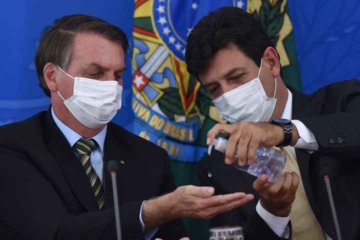 Brazilian President Jair Bolsonaro (left) fired Minister of Health Luiz Henrique Mandetta (right) this week after the two differed on how the government should respond to the coronavirus outbreak. Mandetta has pushed Brazilians to socially distance. Bolsonaro regards the virus as a media-driven conspiracy.