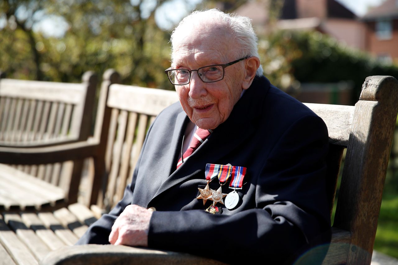 Captain Tom Moore, 99, poses after he continued to raise money for health workers, by attempting to walk the length of his garden one hundred times before his 100th birthday this month.