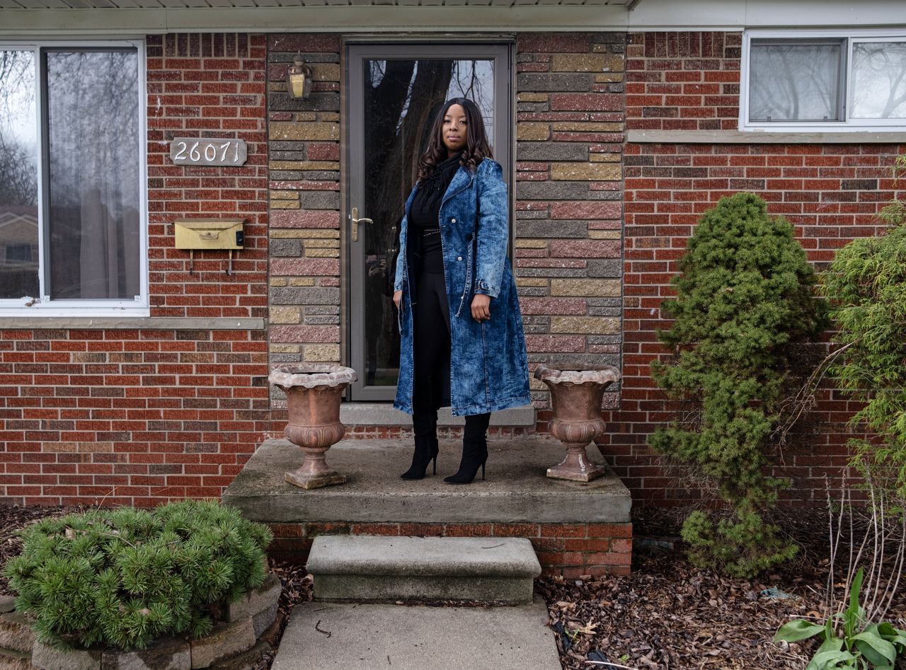 Chilah Harper, shown at her home in Redford, Michigan, has fully recovered from COVID-19. She said at one point during the illness, "I felt like I was being strangled."
