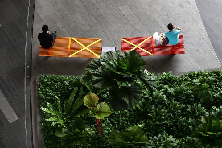 "X" marks the spot: People in Singapore practicing social distancing last month.