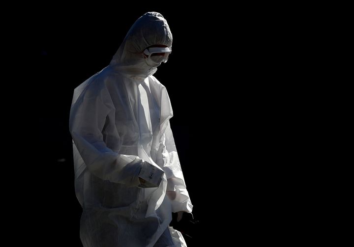 A person in a protective suit near St James' Park as the spread of coronavirus disease (COVID-19) continues in Newcastle.