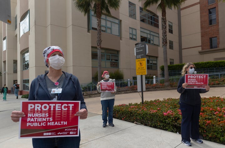 Health care workers are seen protesting outside Santa Monica's UCLA Medical Center. Nurses at&nbsp;Providence Saint John&rsqu