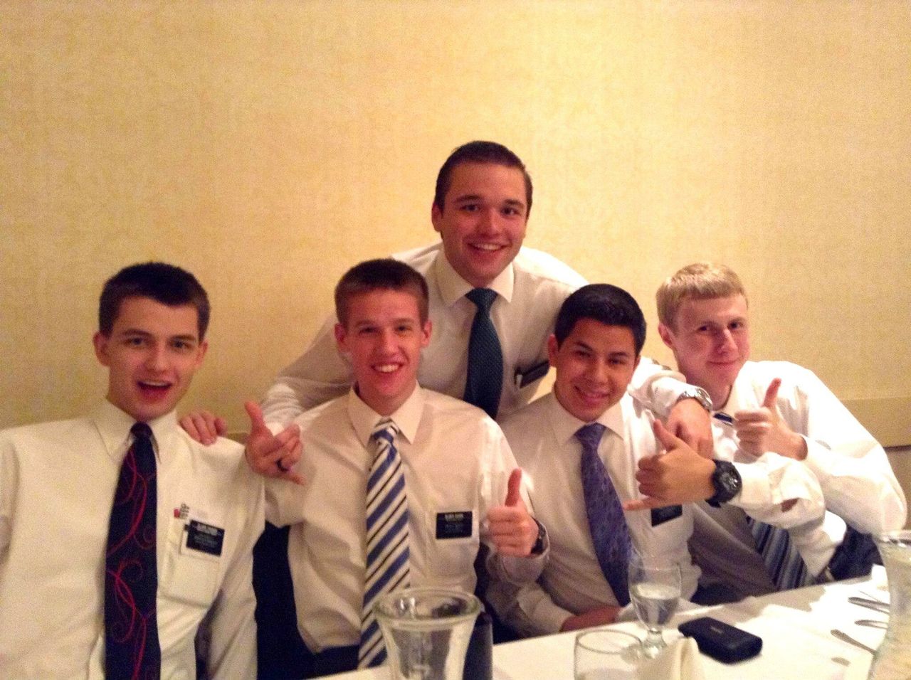 <div class="feature-caption"><em>Ryan Tucker, left, with his fellow missionaries.</em></div>