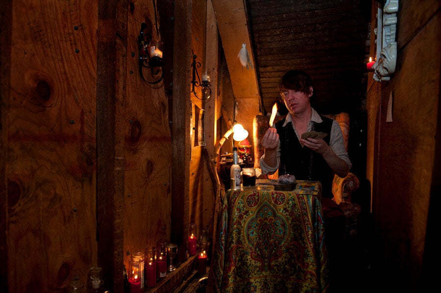 Damon lights Palo Santo at Catland in Bushwick, Brooklyn. (Wendy George/Huffington Post)