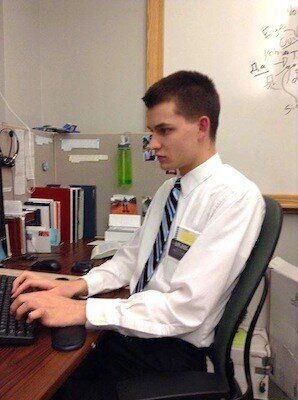 <em>Tucker at a cubicle at the Referral Center Mission.</em>