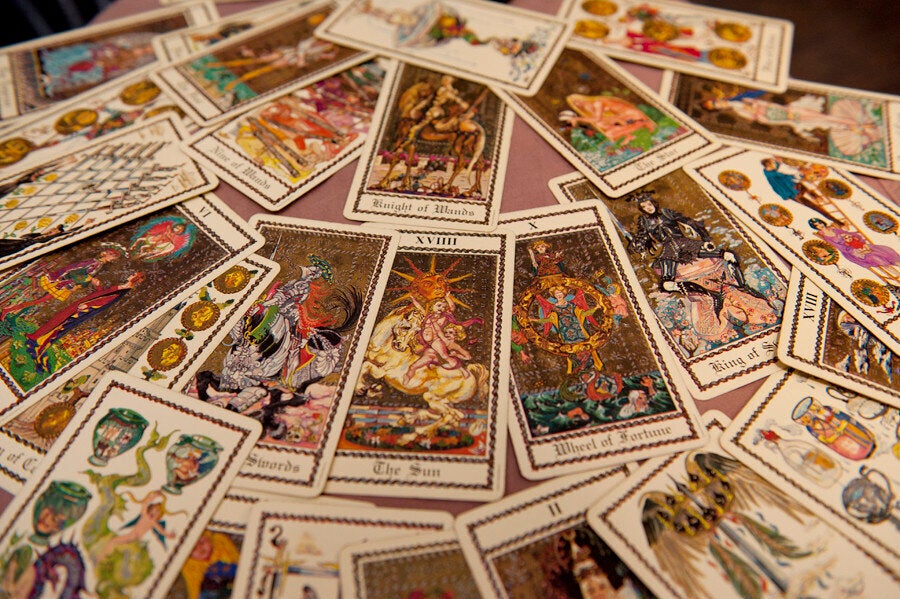<div class="feature-caption"><em>Stella uses the Medieval Scapini deck. She also often has a candle, a blend of cinnamon oil, frankincense oil and other oils for protection and sometimes incorporates wine, ginger tea, mugwort or vervain tea with lemon. She keeps a statue of the Egyptian cat god, Bast, next to her for protection. (Wendy George/Huffington Post)</em></div>