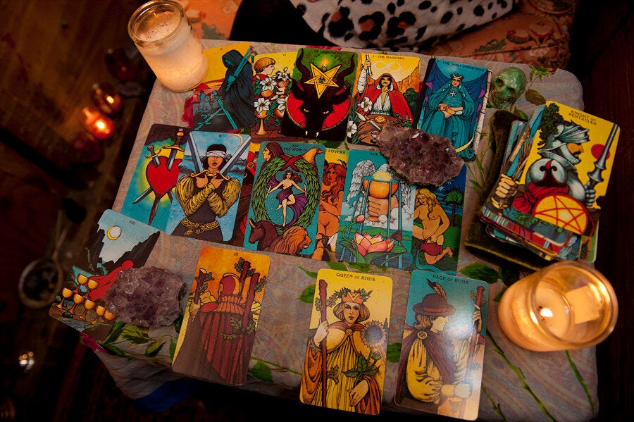 <div class="feature-caption"><em>Molly alternates between the Morgan-Greer and Rider-Waite decks. She often uses crystals (amethyst quartz and green calcite) and candles during readings. </em></div>