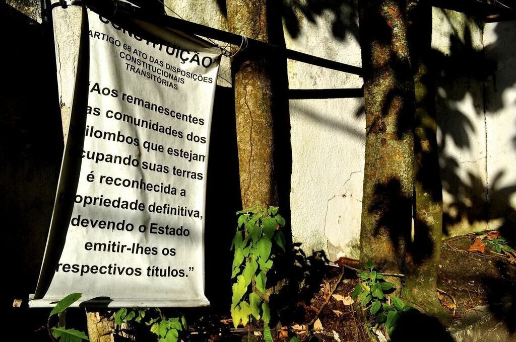 A sign in at the entrance to Sacopã announces the community's quilombo status. (Carolina Ramirez/The Huffington Post)