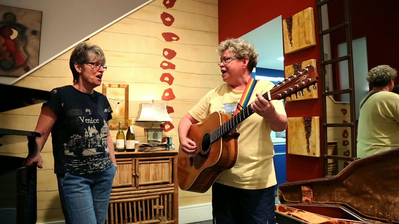 Ann Huckstep, right, with her partner, Carol Misner, in their loft in downtown Birmingham in 2013. (Photo by Michele Forman)