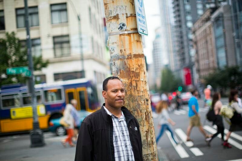 Jeremy Bradford, a former suit salesman who was arrested for drugs more than 20 times in half as many years, stands for a portrait in downtown Seattle on Thursday, Aug. 14, 2014. Mike Kane for The Huffington Post