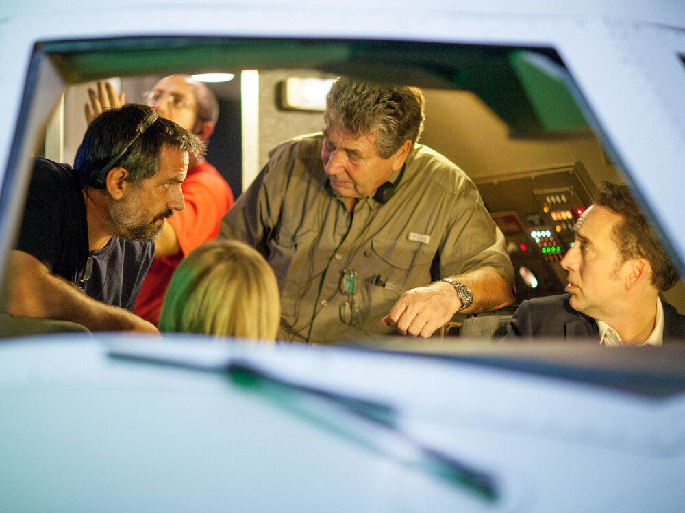 <div class="feature-caption"><em>Lalonde, left, with director Vic Armstrong, center, and Nicolas Cage on the set of "Left Behind" in August 2013. (Photo: Stoney Lake Entertainment)</em></div>