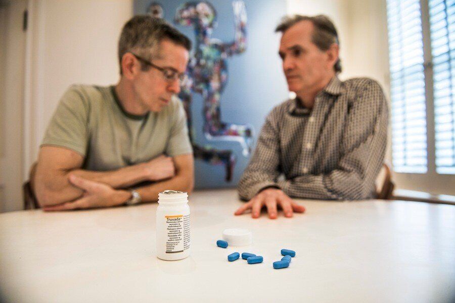<div class="feature-caption"><em>Longtime friends Peter Staley, left, and Sean Strub pose for a portrait in Strub's home in Milford, Pennsylvania. Truvada, the HIV preventive drug, sits on the table before them. (Photo by Damon Dahlen)</em></div>