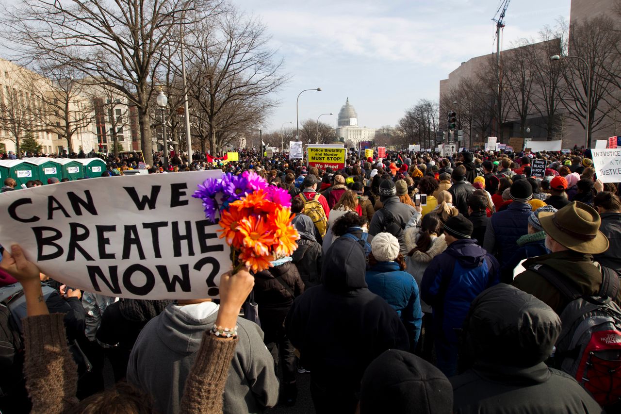 Demonstrators march toward Capitol Hill in Washington, Saturday, Dec. 13, 2014, during the "Justice for All" march. (AP Photo/Jose Luis Magana)