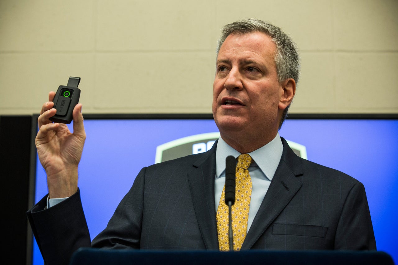 New York City Mayor Bill de Blasio holds up a body camera during a press conference on Dec. 3, 2014, in New York City. (Andrew Burton/Getty Images)