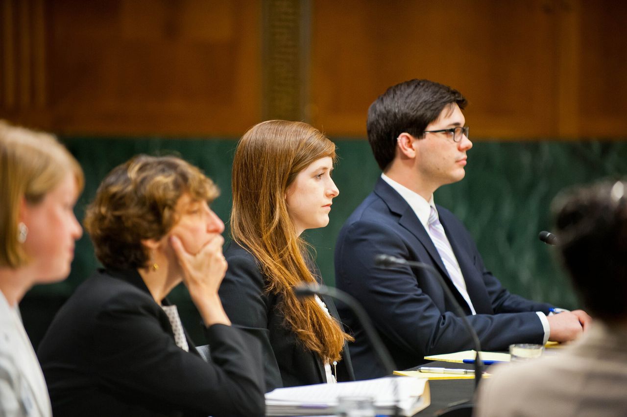 <em>Know Your IX co-founder Dana Bolger, center, sits next to John Kelly, a Tufts University student and fellow sexual assault activist during a roundtable hosted by Sen. Claire McCaskill (D-Mo.).</em>