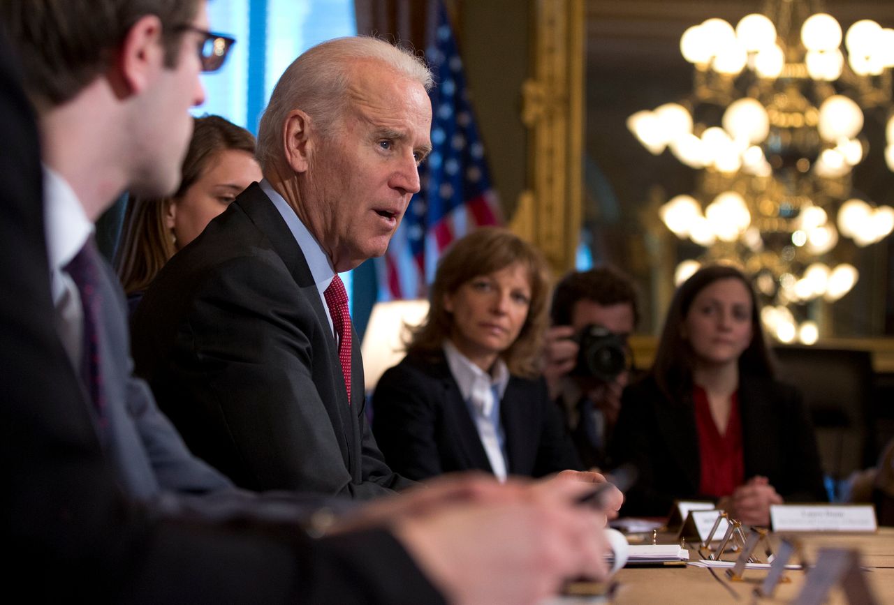 Vice President Joe Biden speaks to media as he meets with representatives of student groups, including Diane Rosenfeld, second from right, and Laura Dunn, right, in the Eisenhower Executive Office Building in the White House Complex, Tuesday, Feb. 18, 2014, in Washington, as part of the Campus Sexual Assault Task Force. (AP Photo/Carolyn Kaster)
