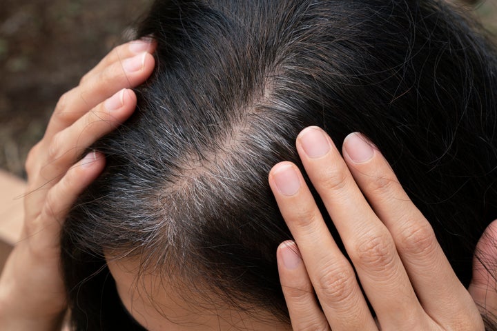 Unwanted grays and exposed roots might not be noticeable over webcam to most, but if they're giving you grief, consider tinted dry shampoos are root touch-up sprays to tide you over.