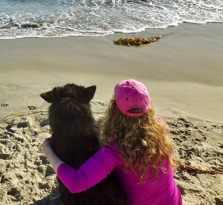 Black with her dog, Bear.