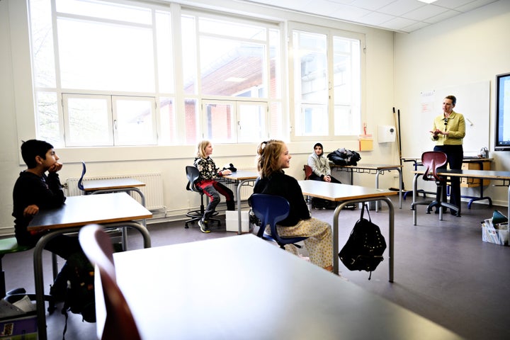 Danish prime minister Mette Frederiksen speaks to pupils as she participates in the reopening of Lykkebo School in Copenhagen, Denmark, on April 15, 2020.