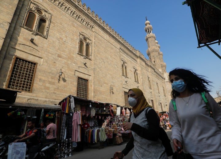 Women wear face masks while walking in Cairo, Egypt, on April 16, 2020, ahead of the Muslim holy month of Ramadan. 