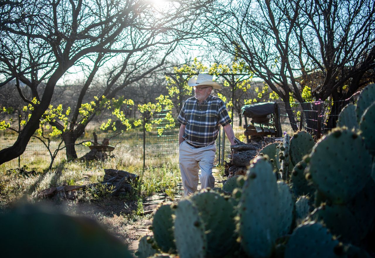 Dan Kelly, a 74-year-old retiree with chronic obstructive pulmonary disease, stands at his Arivaca home on April 15. Kelly has made close to 150 masks for fellow Arivaca residents since the novel coronavirus pandemic.