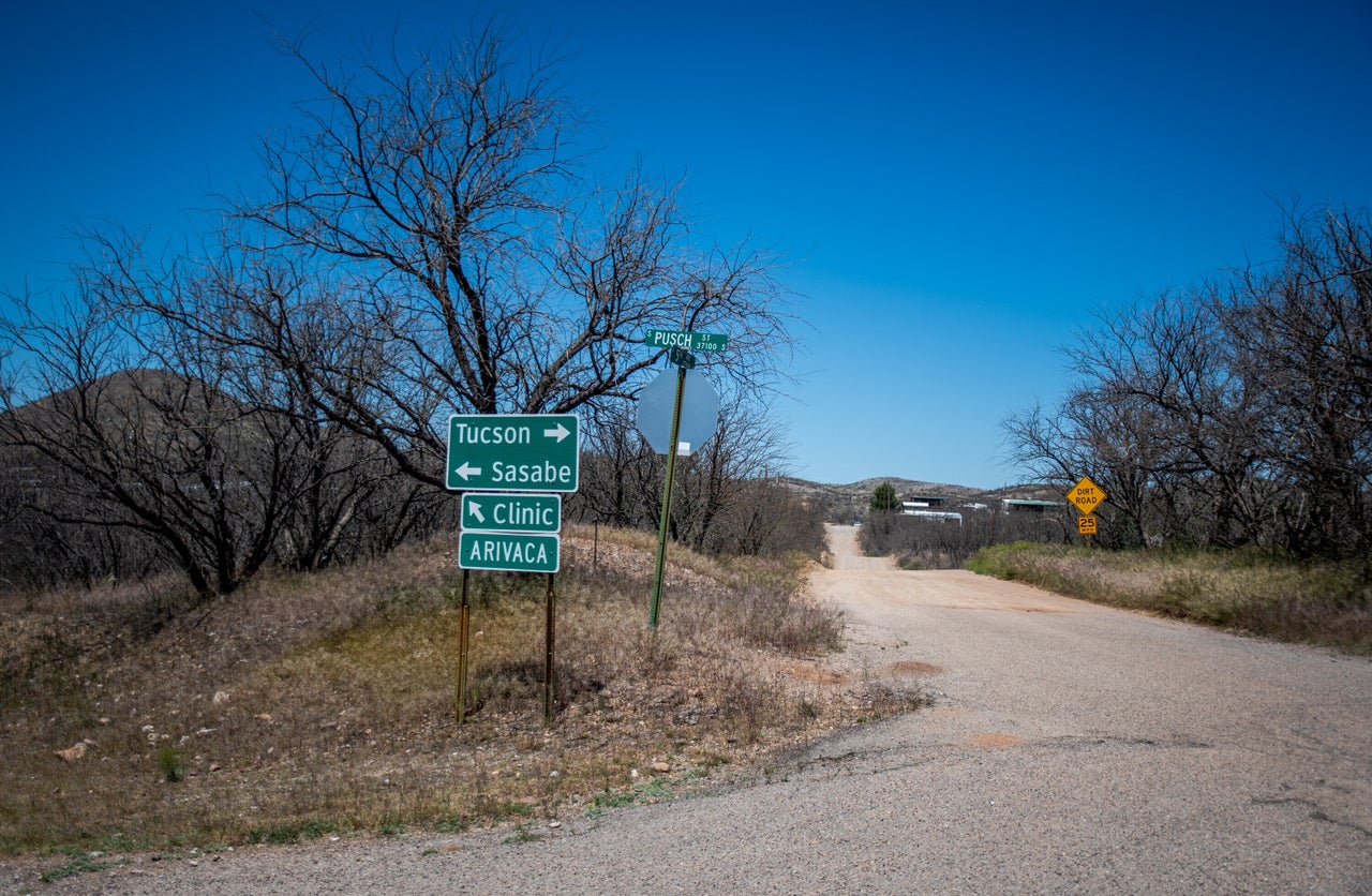 A sign for the only medical clinic in Arivaca marks a junction at the end of town.