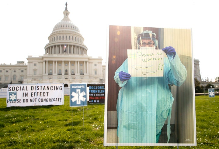 In a protest designed to adhere to social distancing guidance, 1,000 signs were arranged on the lawn of the U.S. Capitol Building showing the faces of nurses and other frontline health care workers pleading for adequate PPE on April 17.