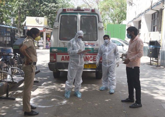 A suspected coronavirus positive patient with Delhi police and health workers at the Aruna Asaf Ali Government...