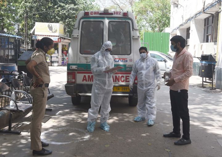 A suspected coronavirus positive patient with Delhi police and health workers at the Aruna Asaf Ali Government Hospital, on April 17, 2020 in New Delhi.