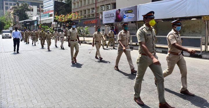 Police flag march appealing people to stay home, during nationwide lockdown in Mumbai.