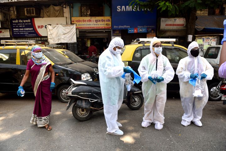 A medical officers step out after testing residents of Jijamata Nagar, Worli on April 14, 2020 in Mumbai.