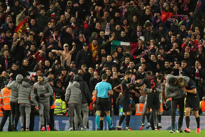 Atletico Madrid players celebrate with fans at the end of the match against Liverpool on March 11.