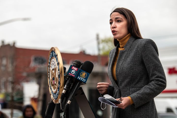 Rep. Alexandria Ocasio Cortez speaks at a news conference in Corona, Queens. Her congressional district has been hit especially hard by the COVID-19 pandemic.