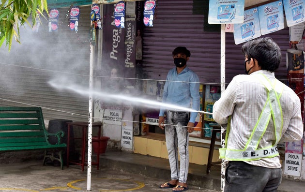 An East Delhi Municipal Corporation (EDMC) worker sprays disinfectant while sanitizing the Khichdipur...