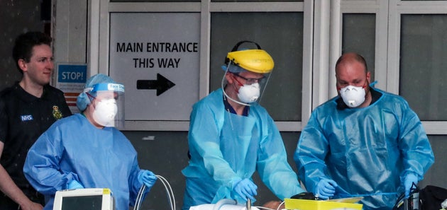 Paramedics and staff at the Royal Liverpool University Hospital wearing various items of PPE