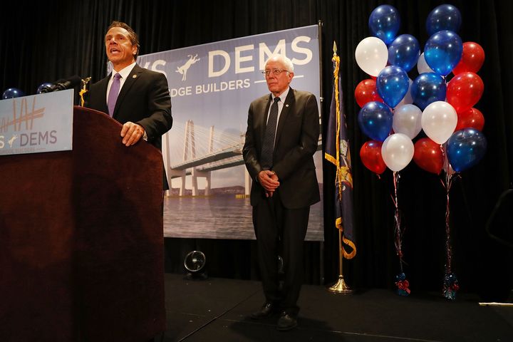 New York Gov. Andrew Cuomo (D) introduces Bernie Sanders at the Democratic National Convention in 2016. Cuomo's budget could limit Sanders' leverage at the 2020 convention.