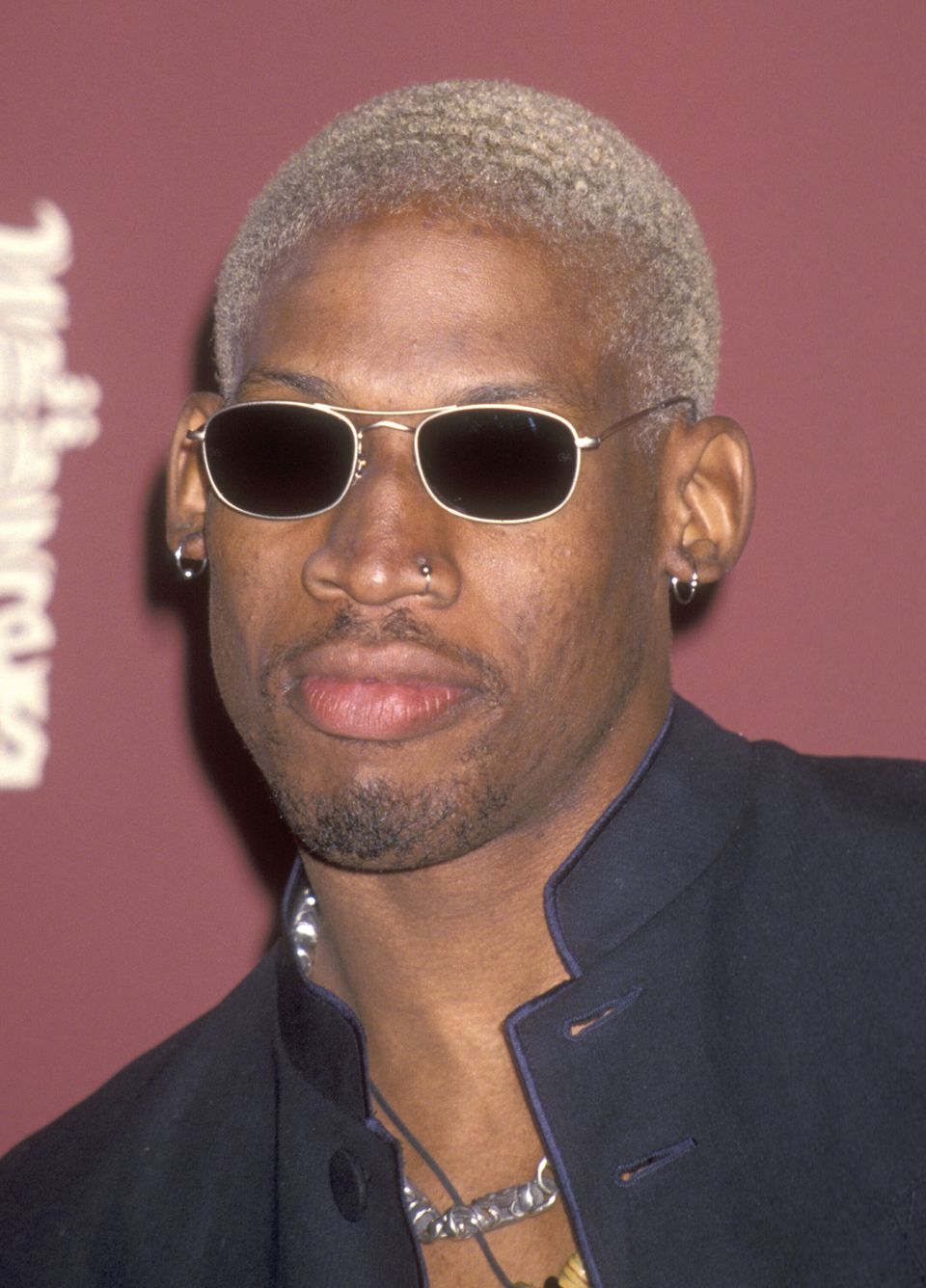 Chicago Bulls' Dennis Rodman, with a new red hair color, shouts