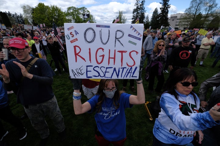 Hundreds of people demonstrated outside Washington's state Capitol over the weekend in protest of Gov. Jay Inslee's stay-at-home order.