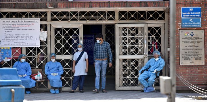 Doctors and other medical staff seen in PPE outside emergency ward on day nineteen of the 21-day nationwide lockdown to check the spread of coronavirus, outside Lok Nayak Jai Prakash Narayan (LNJP) Hospital, on April 12, 2020 in New Delhi, India. (Photo by Sushil Kumar/ Hindustan Times via Getty Images)