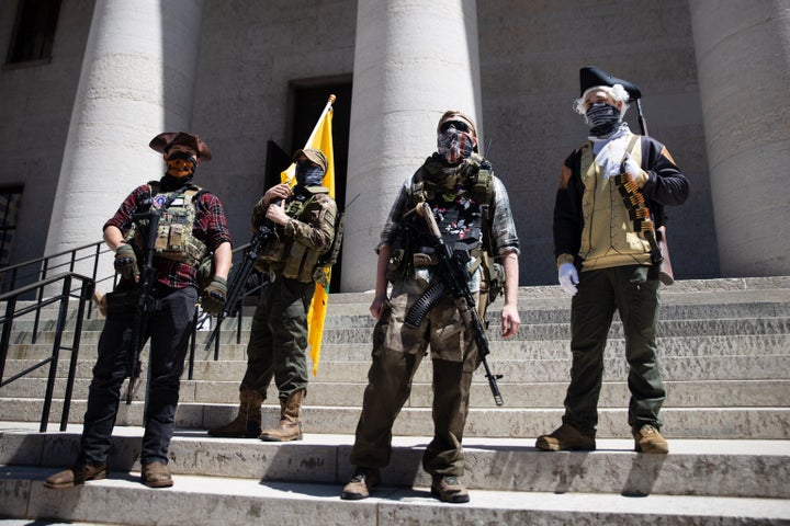 A local militia group is seen at a rally to protest the stay-at-home order amid the Coronavirus pandemic in Columbus, Ohio, o