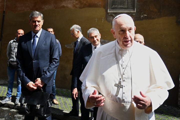 Pope Francis talks to the media after he celebrated Mass behind the closed doors of the Santo Spirito in Sassia church i