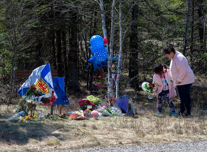 A memorial pays tribute to Heather O’Brien, a victim of this past weekend shootings along the highway in Debert, Nova Scotia, on Tuesday, April 21, 2020. (Andrew Vaughan/The Canadian Press via AP)