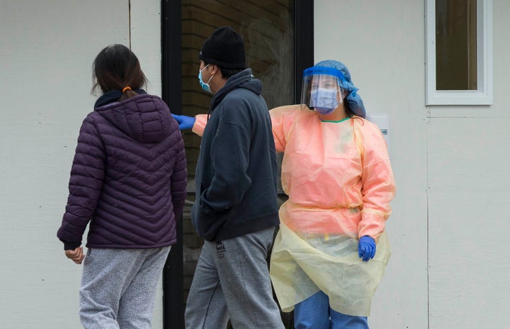 Patients arrive at the COVID-19 assessment centre at Scarborough Health Network Centenary Hospital in Toronto on April 16, 2020. 