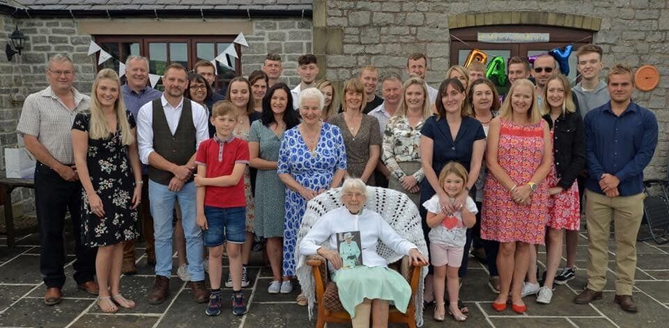 Joan Cavanagh with her family at her 100th birthday party