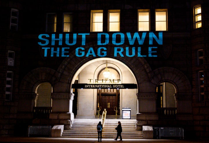 Activists from the Population Connection Action Fund project a protest message onto the Trump International Hotel in Washington on Jan. 23, 2019.