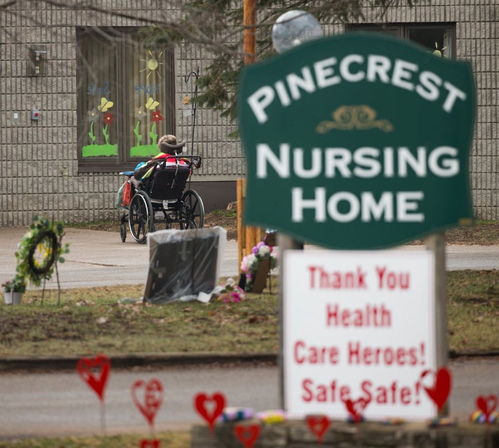 A resident of Pinecrest Nursing Home in Bobcaygeon, Ont. gets some fresh air outside the home, which has become a hotspot for COVID-19. 