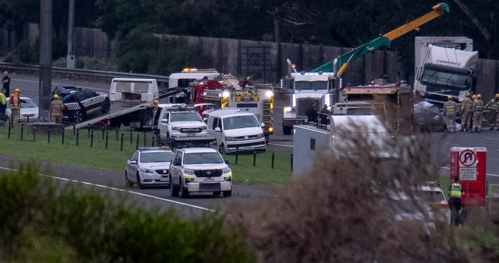 Police and emergency services continue to work at the crash site, which saw four police officers killed, along the Eastern Freeway on April 23, 2020 in Melbourne, Australia. Four police officers were killed when a truck crashed into them during a roadside stop on the Eastern Freeway in Melbourne on Wednesday night. The officers had pulled over a Porsche for speeding when a semi-trailer truck collided with them. The Porsche driver fled the scene on foot while the driver of the truck was taken to hospital with non life threatening injuries. The deaths of the two male constables, one female senior constable and one male senior constable is the largest single loss of police lives in one incident in the history of Victoria Police. (Photo by Luis Ascui/Getty Images)