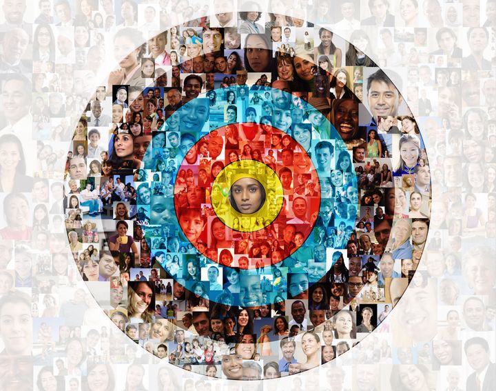 Hundreds of social media portraits are superimposed over a target.