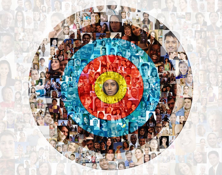 Hundreds of social media portraits are superimposed over a target.