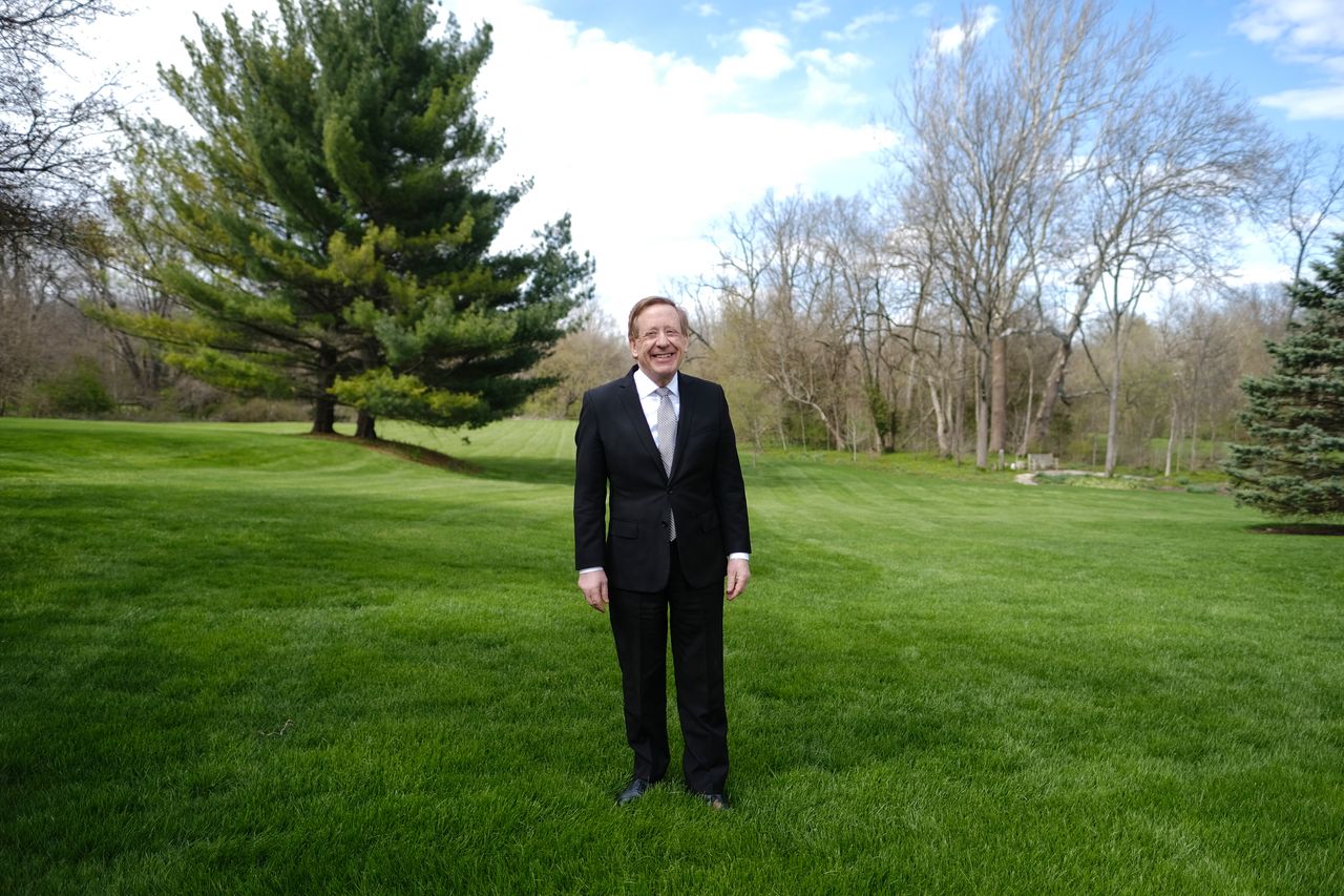 Mayor James Brainard poses for a portrait at his home in Carmel, Indiana. “We’re trying to save people’s lives by cutting down on the spread of this virus.”